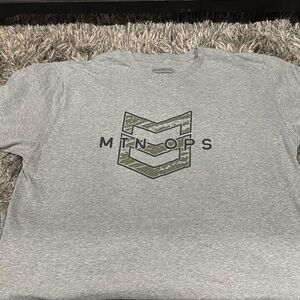 Brand new. Never worn. MTN OPS T Shirt. XL but fits more like L